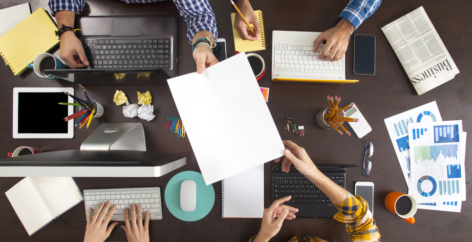 Group of Business People Working on an Office Desk